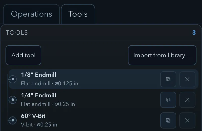 The Tools tab listing a 1/8 inch endmill, a 1/4 inch endmill and a 60 degree V-bit, each row carrying its own duplicate and remove buttons, above the Add tool and Import from library actions